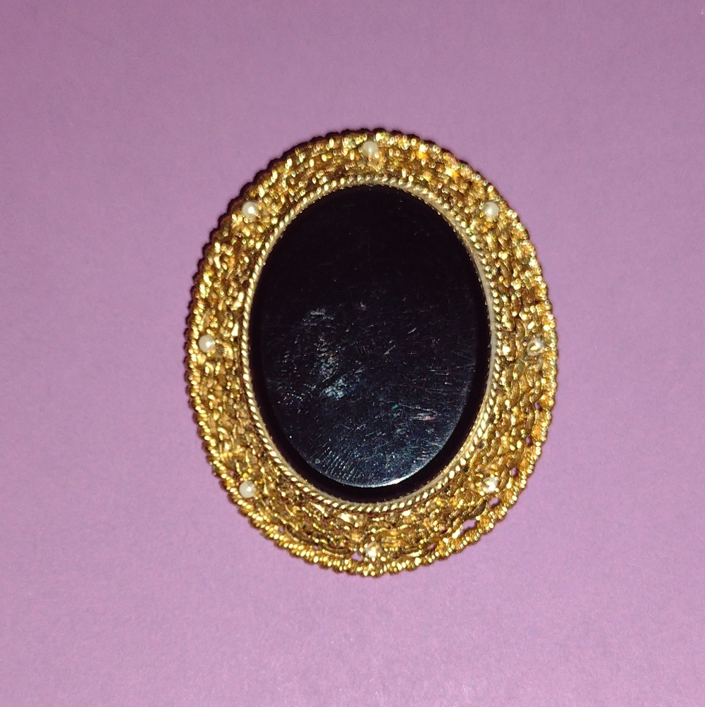 Vintage-Inspired Gold and Black Brooch